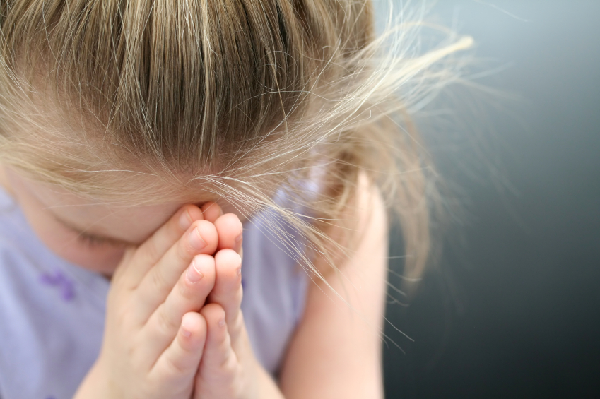 young praying girl