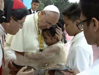 Child embracing the pope