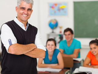 Smiling teacher in classroom