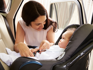 mother and baby in car