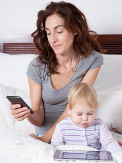 mom texting and baby